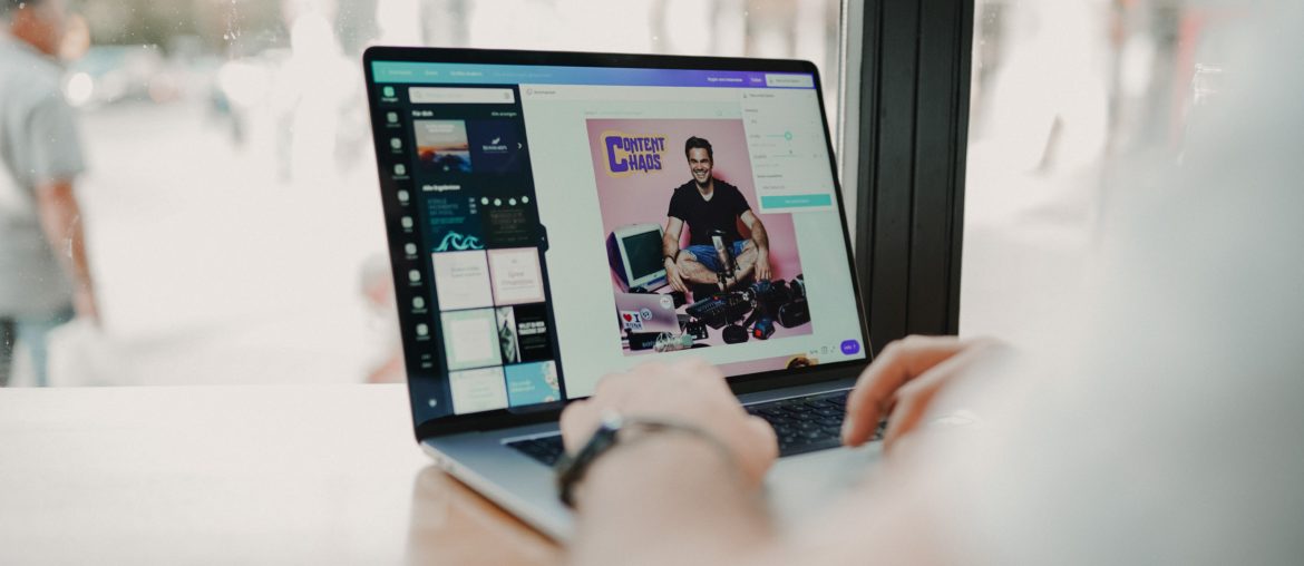 man creating marketing assets on laptop with Canva