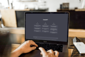a person using chatGPT on their laptop